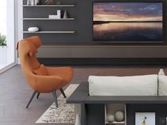 Side view of the Olivia 4-legged chair with removable headrest and lumbar cushions