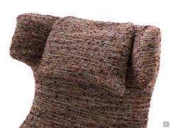 Detail of the removable headrest cushion of the armchair Olivia