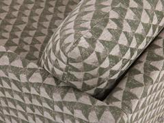 Detail of the soft feather cushion that rests on the perimeter structure of the Aker armchair