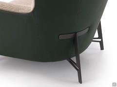 Detail of the metal feet in Vulcan Grey finish, with a particular shape that seems to support the backrest at the rear