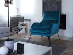 Armchair with shaped armrests Mabel in a modern setting