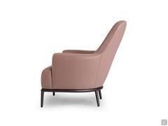 Side view of the René armchair with high, sloping backrest