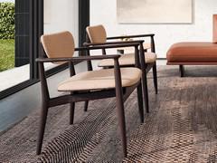 Elegant pair of Victoria armchairs with dark solid wood frame and upholstered seat and back cushions