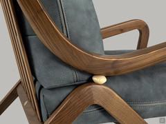 Detail of the wooden joint joining the curved solid wood of legs and armrests