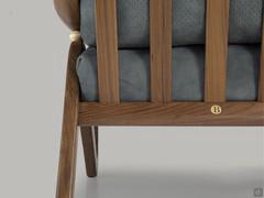 Detail of the slatted structure that houses the leather-covered cushions with small holes on the back to let air out in the crush