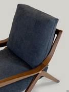 Detail of the solid wood armrest and cushions upholstered and covered in fabric