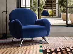 Lune round-back armchair, complete with high, slender painted metal feet