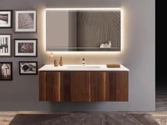 Front view of the unit with central basin base and two side units: note the perfect 'positive-negative' pattern created by the solid canaletto walnut slats