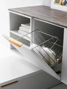 Close-up of the base unit with drop-down door and laundry basket