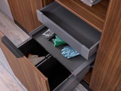 Pull-out door at the bottom of the open column, equipped with laundry rack, internal drawer and sliding tray