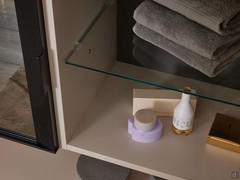 Lacquered interior to match the outer structure and transparent glass middle shelf