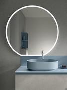 Art washbasin in coloured ceramic, available in four different colours. The Halo round mirror is another element included in the composition