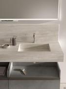 Front view of the wall-hung stoneware shelf, with integrated 50 x 30 cm basin and back splashback to match the 30 cm high top