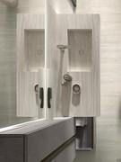 Top view of the wall-hung bathtub and stoneware shelf. The bathtub is fitted as standard with a drain with matching stoneware plug