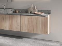 Bathroom composition with washbasin base unit, 1-door base unit and 1-drawer base unit. Stone-effect melamine structure and stoneware top