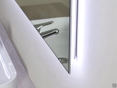 Detail showing the mirrored sheet and the perimeter LED profile, all enclosed in a thickness of only 3 cm