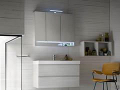 Stocky mirror with LED spotlight model Tod. The lower open compartment is illuminated by the optional LED profile
