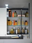 Interior storage compartment with glass shelves