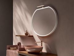 Halo round shaped bathroom mirror with flat top side and additional LED spotlight