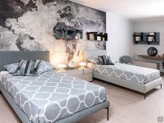 Bed Pinch paired with Sirio bed, both squares and matching finishes for a boys' room