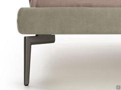 Detail of the tall burnished metal foot matching the slim h.9 bed frame