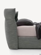Designer bed with wraparound headboard Destin, with high bed frame and upholstered in matching