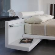 detail of the upholstered bench that works as built-in nightstand with optional glass shelves and led lightning