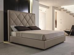 Olivier double bed with tall quilted headboard