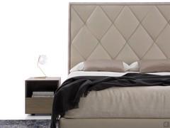 Padded headboard embellished with rhombus quilting