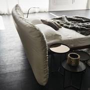 Close-up of the shaped faux-leather headboard 