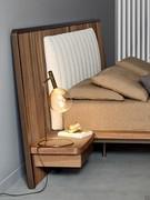 Design with rounded corners and matt bronze lacquered wood headboard profile