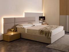 Complete composition with bed and Freeport Boiserie panels, flat upholstered on the left-hand side, curved along the bed headboard, and dove-grey lacquered panels with open element on the right-hand side