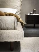 The Pascal bed is supported by 4 solid stained ash wood feet, available in two different colours