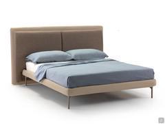 Taylor double bed shown here with plain fabric upholstery matching the headboard cushions covered in a darker shade of textured fabric
