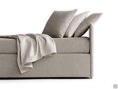 Decorative cushions covered in fabric to match the bed and mattress cover