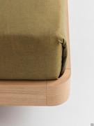 Detail of the P28 bed frame, with curved joints and available in matt lacquered, mica or oak veneer (version pictured)