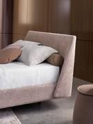 Detail of the upholstered headboard that laterally folds over the bed frame