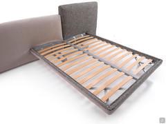 Detail of the slatted bed base attached to the headboard and allowing freestanding bed positioning