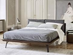 Wooden bed with Florida headboard cushions, also in matt lacquer