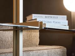 Detail of upright with matching shelf support in nickel-painted metal