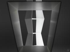 Detail of the Cult modern metal bookcase, with its rigorous and minimalist design that can be customised in RAL colours or in the material finish corroded bronze