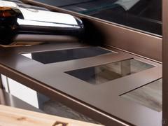 Detail of the bottle compartments of the Milton bookcase shelf. Available in two sizes, for 5 or 8 bottles