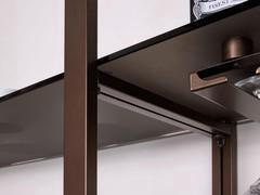 Crosspiece to hold shelves that continue beyond the space between two uprights. All details are made of metal and painted in the same colour