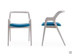 Front and side view of the chair Nakama in natural gray walnut wood