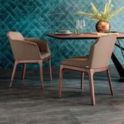 Musa dining tub by Cattelan chair in the versions with or without armrests