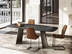 Monica padded chairs with metal cantilever base. Leather upholstery and metal base in the Titanium finish.
