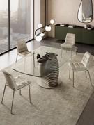 Dama leather-upholstered chairs with Titanium metal frame matching the Vortex table base