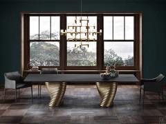 The Iside armchair with 4 legs and the Vortex table. Legs and seat upholstered in leather. 