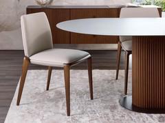 Chair Hiru upholstered in Lord full-grain leather with solid walnut-stained ash legs