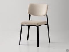 Omnia in the chair version with upholstered seat and backrest, one of three variants available (also two-tone with two-covered cushions)